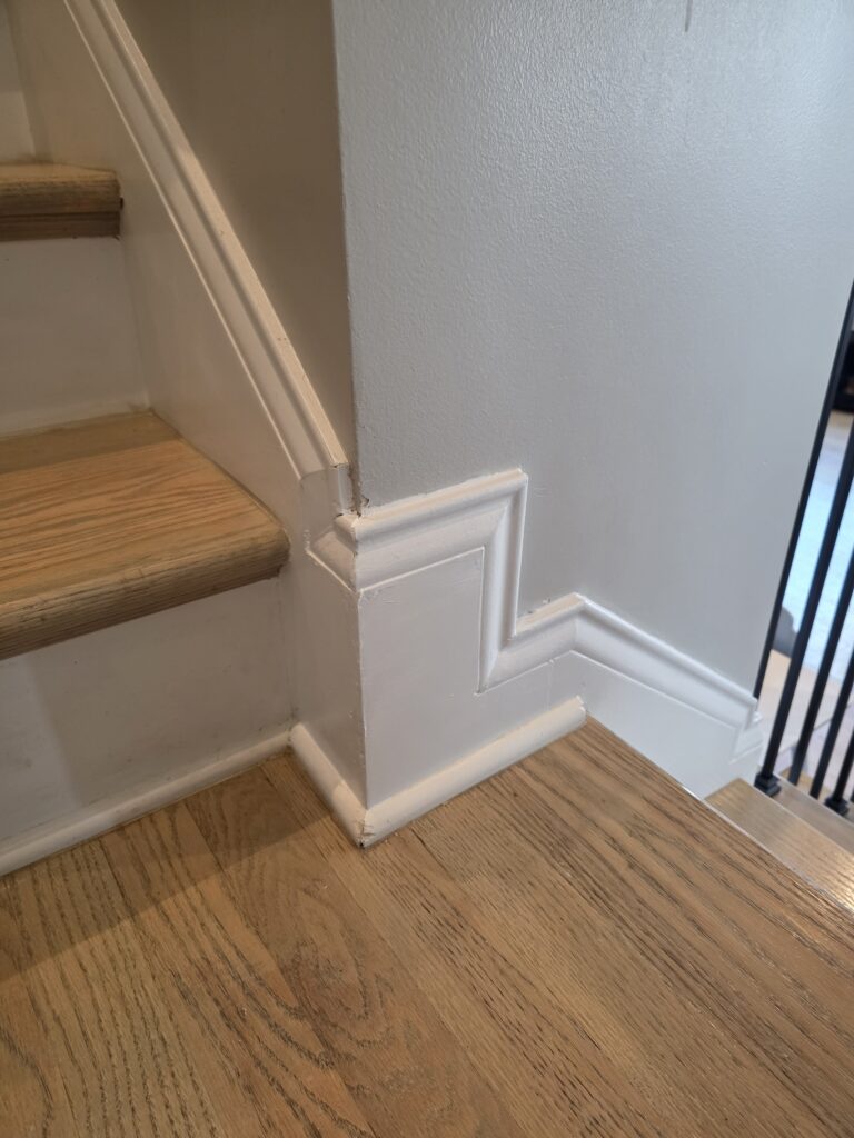 Repaired and restored baseboard trim after professional repair