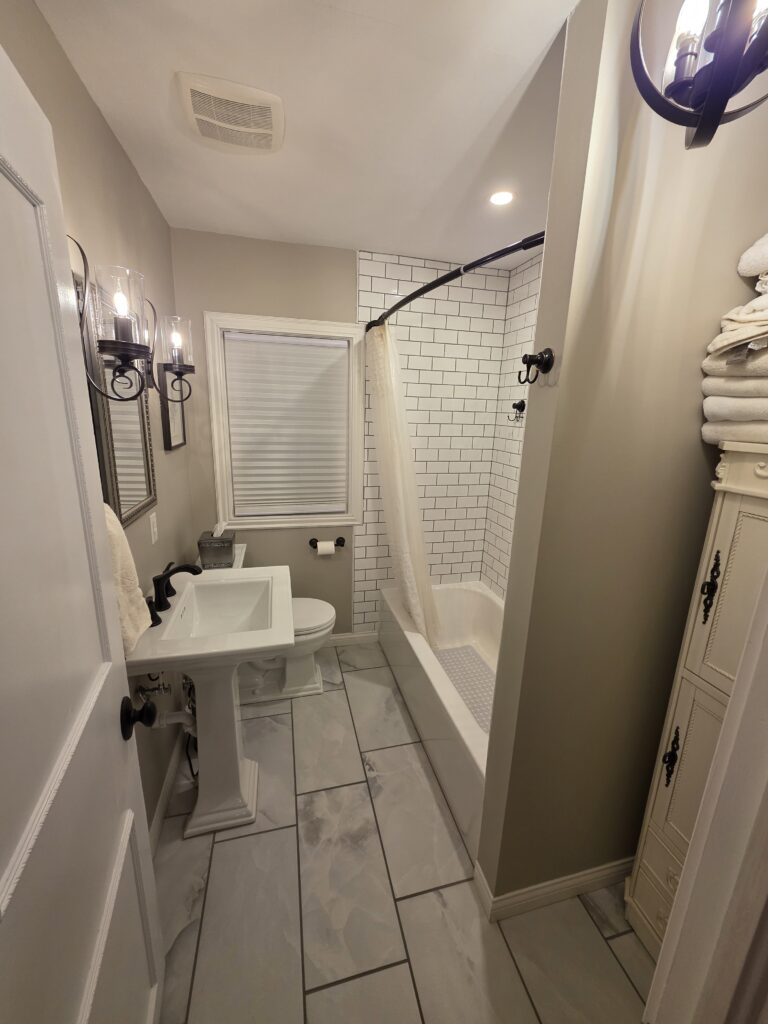Completed bathroom remodel in Haubstadt Indiana with subway tile shower and tile flooring