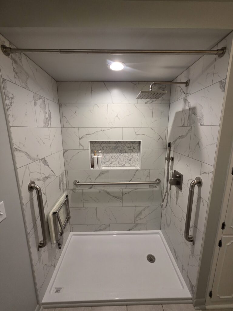 After tub to shower conversion in Haubstadt Indiana featuring tiled walk in shower with custom niche and grab bars