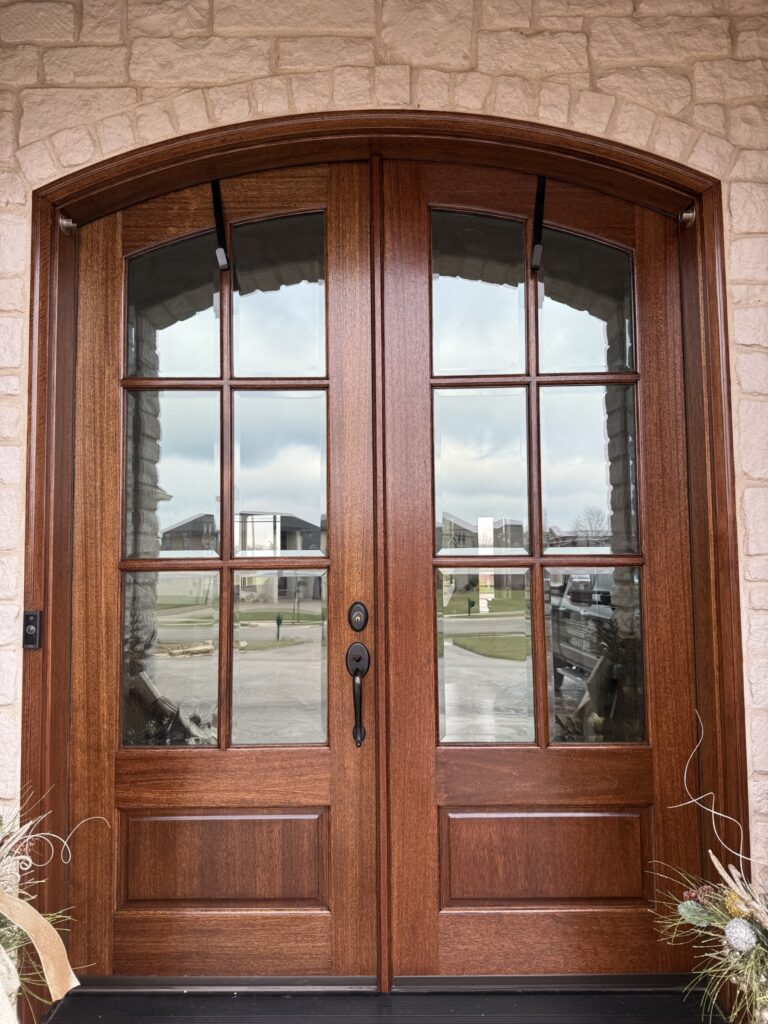 After photo of refinished wood double front doors in Cambridge subdivision Evansville Indiana